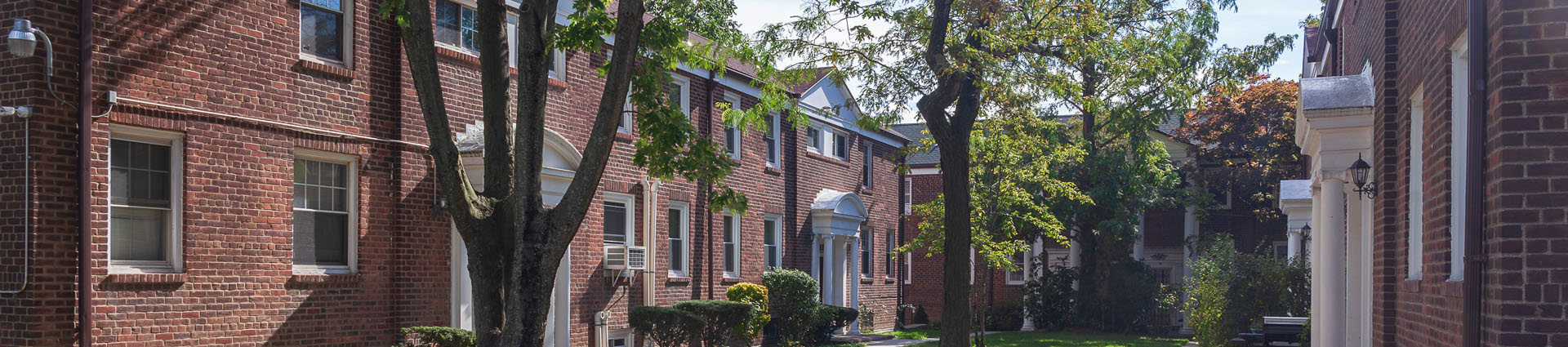 multifamily building complex wrapped around a courtyard