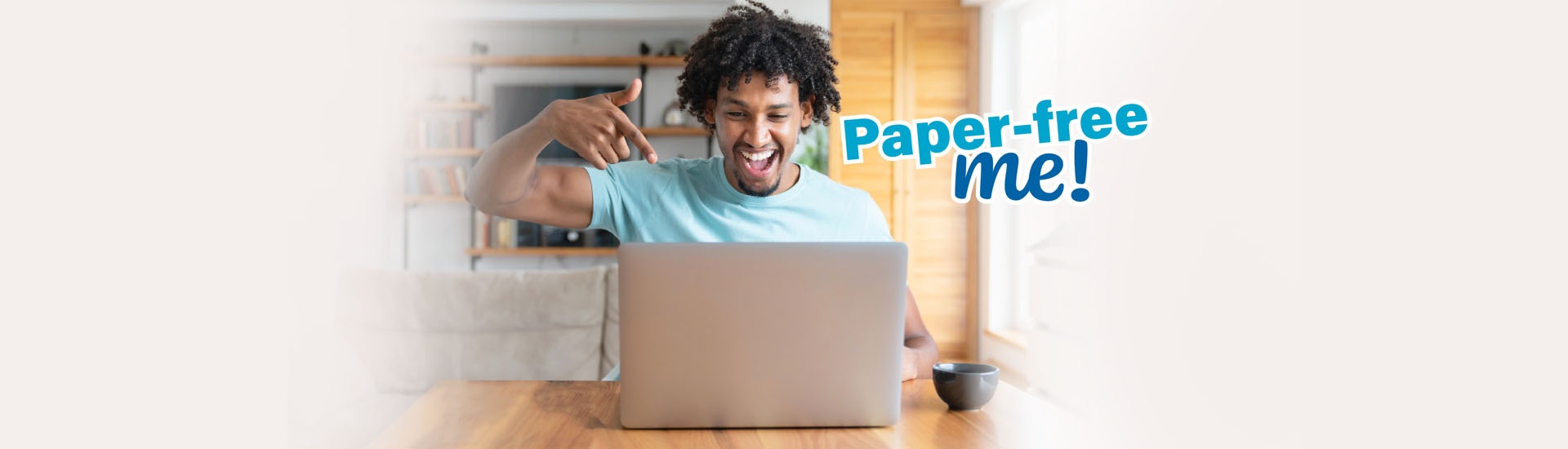 happy african american man pointing at laptop