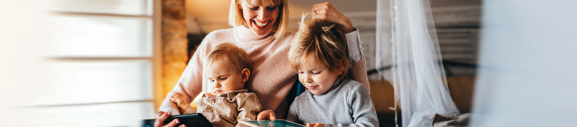 smiling mom and children sitting together